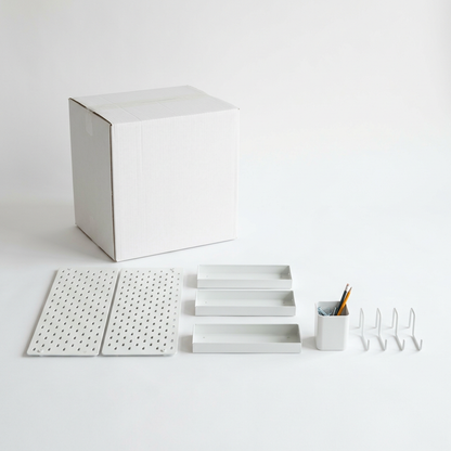Plain unbranded white box with the full white pegboard organizer kit arranged in front