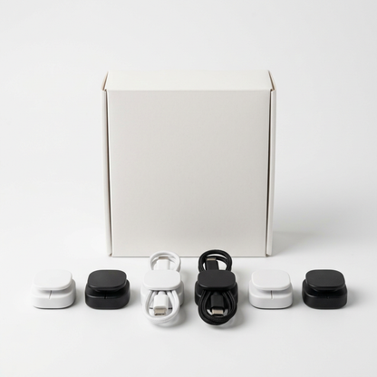 Plain unbranded white box with six magnetic cable clips arranged in front