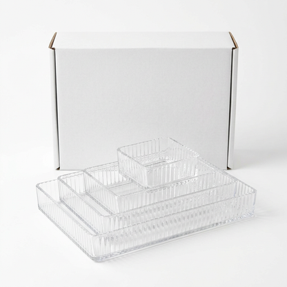 Plain unbranded white box with four nested clear acrylic organizer bins in front